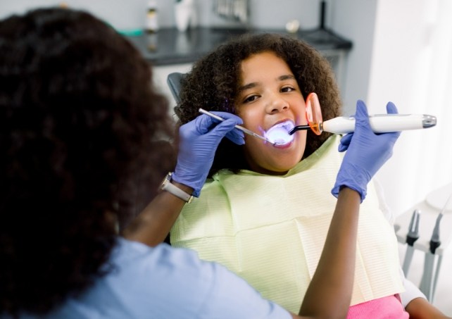 Young patient receiving dental treatment