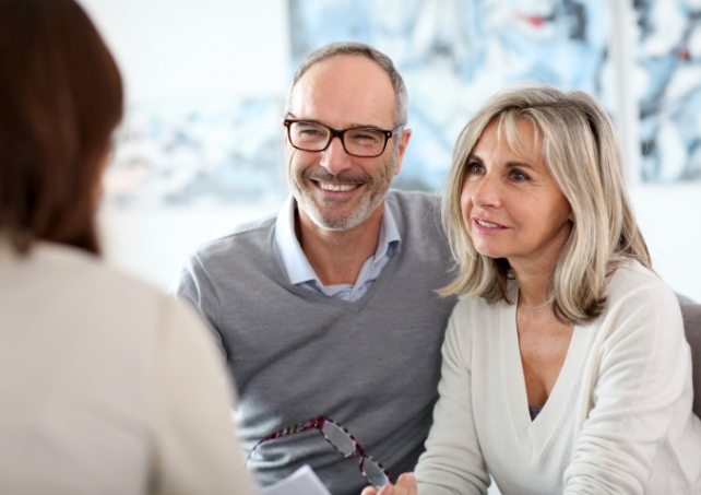 Patients talking to dentist about diagnosis and treatment after oral cancer screening