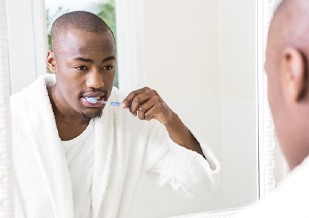 Man brushing teeth in Virginia Beach