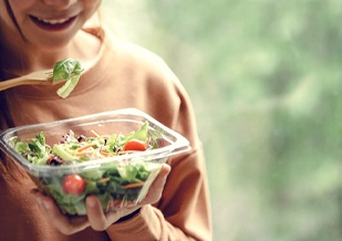 Person eating salad in Virginia Beach