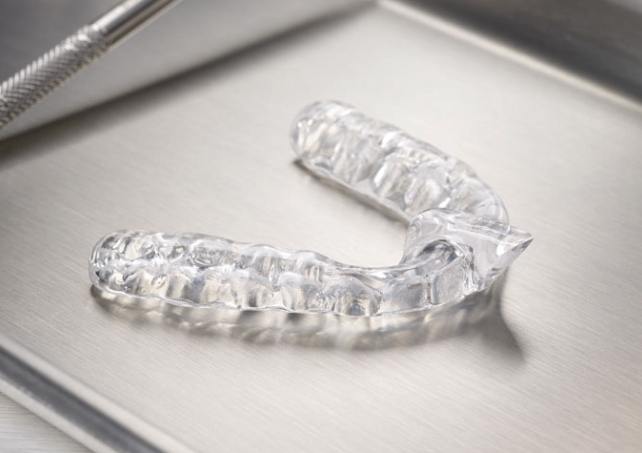 Clear nightguard for bruxism on metal tray