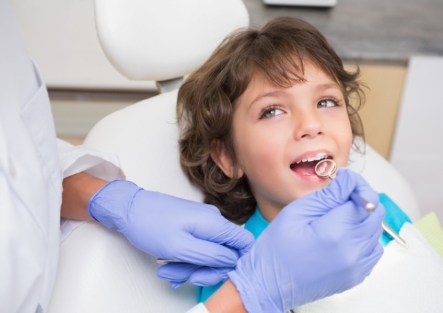 Young patient smiling during children's dentistry visit