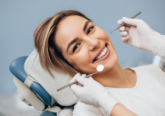 Woman smiling after root canal treatment