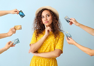 Woman surrounded by credit cards