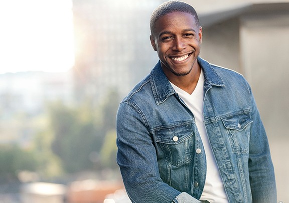 man smiling after getting a root canal in Virginia Beach