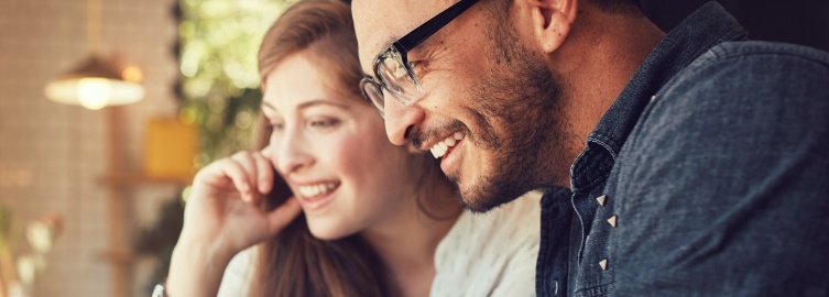 Man and woman with healthy smiles after restorative dentistry