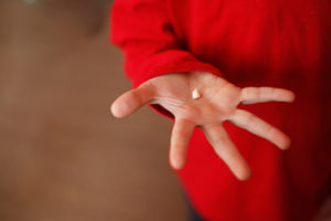 Hand with a knocked out tooth