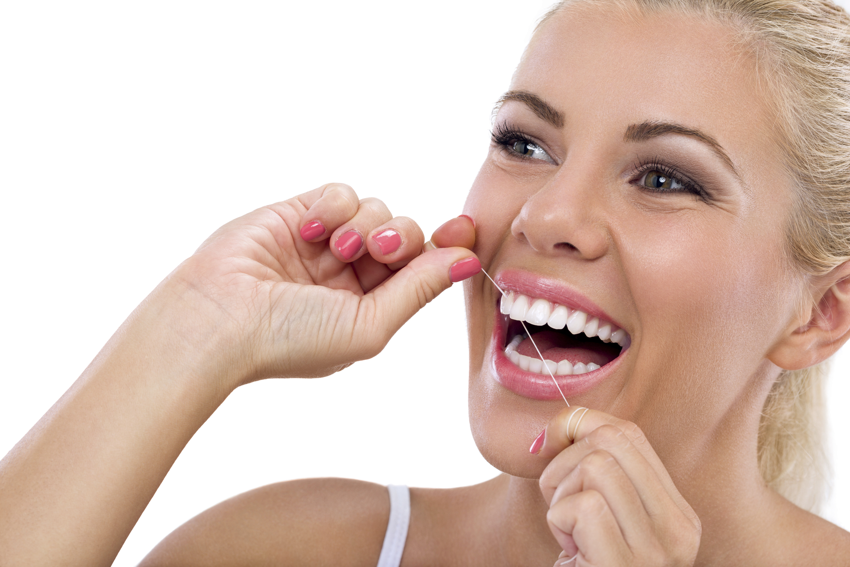 Young woman flossing her teeth Smile Care Family Dentistry Blog