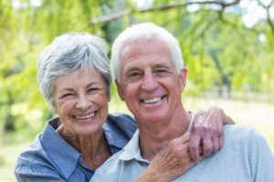 A senior couple smiling